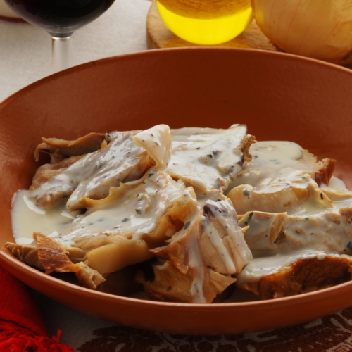A bowl of sliced pork loin smothered in a browned milk gravy. A recipe from Italy called Maiale Al Latte