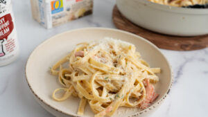 A savory salmon pasta dish served with a rich sauce and fresh garnishes. Real dairy provides a velvety and flavorful finish to this hearty meal.
